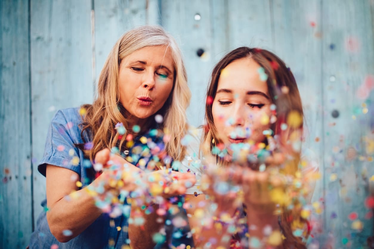 Mother and Daughter With Confetti at a Party | American Pavilion