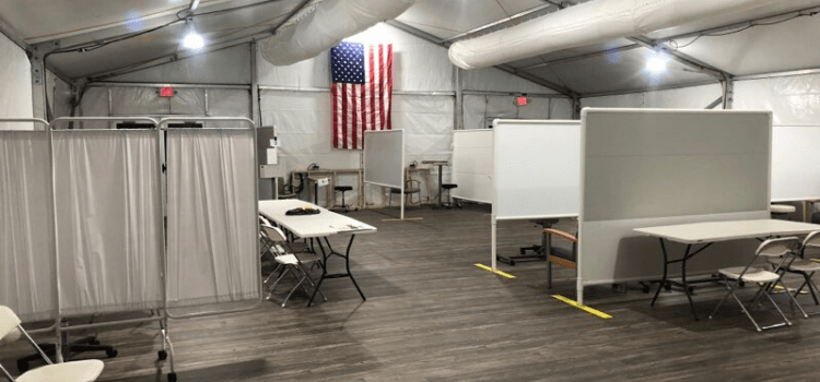 Inside Tents Desks and Social Distancing - American Pavilion