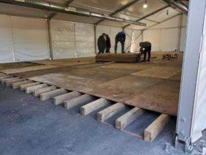 Installing Raised Plywood Flooring - American Pavilion